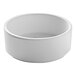 A white Cal-Mil stackable ramekin with a white rim.