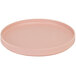 A Cal-Mil blush pink melamine plate with a low rim.