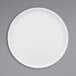 A white Cal-Mil low rim melamine plate.