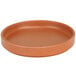 A brown Cal-Mil melamine plate with a low rim.