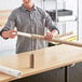 A man holding a Lavex Kraft telescoping mailing tube.