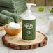 A green Noble Eco Novo Terra body wash bottle with a white cap.