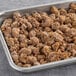 A tray of brown Hungry Planet Plant-Based Italian Sausage Crumble on a table.