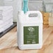 A white jug of Noble Eco Novo Terra hand and body lotion with a green label.