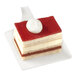 A piece of cake on a Solia white square bagasse pastry display plate.