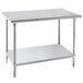 An Advance Tabco stainless steel work table with a shelf.