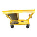 A yellow metal Vestil welding torch and cylinder cart with tools on it.