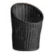 A black woven plastic rattan basket with a curved edge.