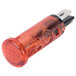 A close up of a red Carnival King indicator light with a black plastic cover.