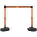 An orange and black Banner Stakes PLUS "Danger - Forklift Traffic" barrier.