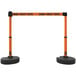 An orange and black Banner Stakes PLUS barricade system with "Danger - Forklift Traffic" tape.