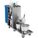 A stainless steel Lakeside housekeeping cart with buckets on it.
