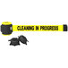 A Banner Stakes yellow wall mount belt barrier with black text reading "Cleaning in Progress" and black and yellow magnetic ends.