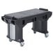 A black Cambro Versa work table with wheels.