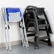 A stack of white and blue Koala Kare infant seat Krades.