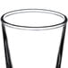 A Libbey shot glass filled with clear liquid.