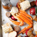 A tray of Chesapeake Crab Connection medium snow crab legs with corn and red potatoes.