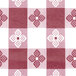 A red and white checkered Intedge vinyl table cover with flowers.