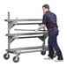 A mobile fully welded steel cantilever rack with three shelves and four caster wheels, designed for heavy-duty storage and transport.