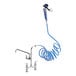 A Waterloo pet grooming faucet with blue coiled hose attached.