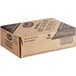 A brown cardboard box with black text reading "Ocean Spray Diet Cranberry Juice Cocktail" on a counter.