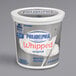 A white container of Philadelphia Original Whipped Cream Cheese Spread with a blue label.