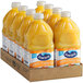 A group of Ocean Spray Orange Juice bottles in a cardboard box.