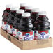 A close-up of a group of Ocean Spray Pure Tart Cherry Juice bottles in a cardboard box.