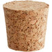 A close up of a cork with a hole in it.