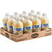 A cardboard box with 12 plastic bottles of Ocean Spray white grapefruit juice.