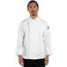 A man wearing a white Uncommon Chef long sleeve chef coat.