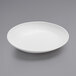 An American Metalcraft white melamine bowl on a gray surface.