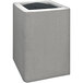 A grey concrete cube with a black top.