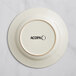 An Acopa ivory stoneware plate with an embossed rim.