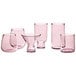 A group of Acopa Mauve stemless wine glasses.