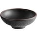 A black bowl with a brown rim.