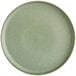 A close up of a sage green Acopa Pangea coupe plate.