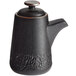 A black stoneware soy sauce pourer with a lid and handle.