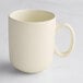 A white Acopa Pangea porcelain mug with a handle.