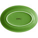 An Acopa Capri palm green stoneware oval coupe platter with a white border.