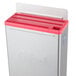 A silver rectangular Edlund stainless steel knife rack with a red lid.