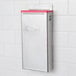An Edlund stainless steel knife rack with red insert.