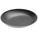 An American Metalcraft black and white slanted melamine bowl with speckles.