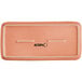 A rectangular terra cotta matte porcelain platter with a white border.