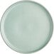 A close up of an Acopa Harbor Blue Matte Coupe Porcelain Plate.