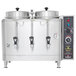 A large stainless steel Cecilware automatic coffee urn with two pots on top with black handles.