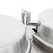 A close-up of two Cecilware stainless steel coffee urns.