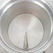 A close-up of a silver Cecilware coffee urn with a handle on top.
