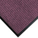 A purple M+A Matting WaterHog door mat with a black rubber border.