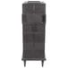 A black plastic Cambro Ultra Camcart food pan carrier with a metal surface.